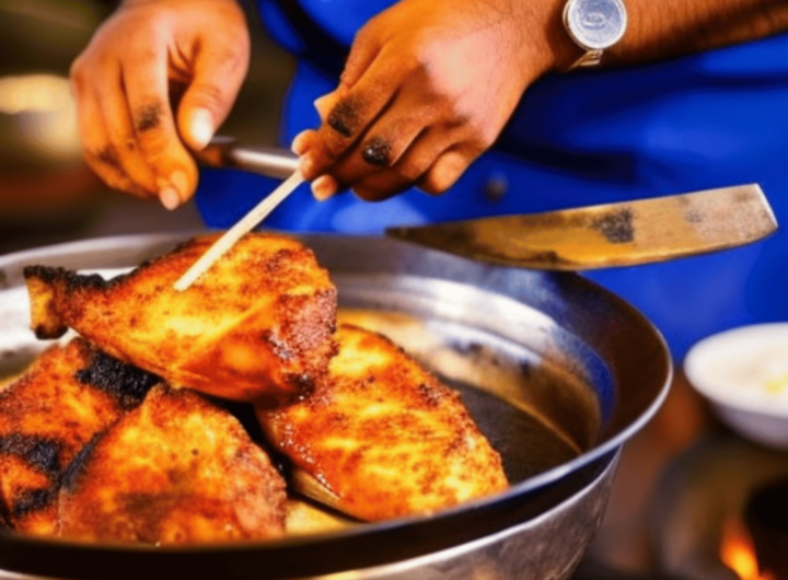 Image of a tandoor in India with a chef preparing tandoori chicken